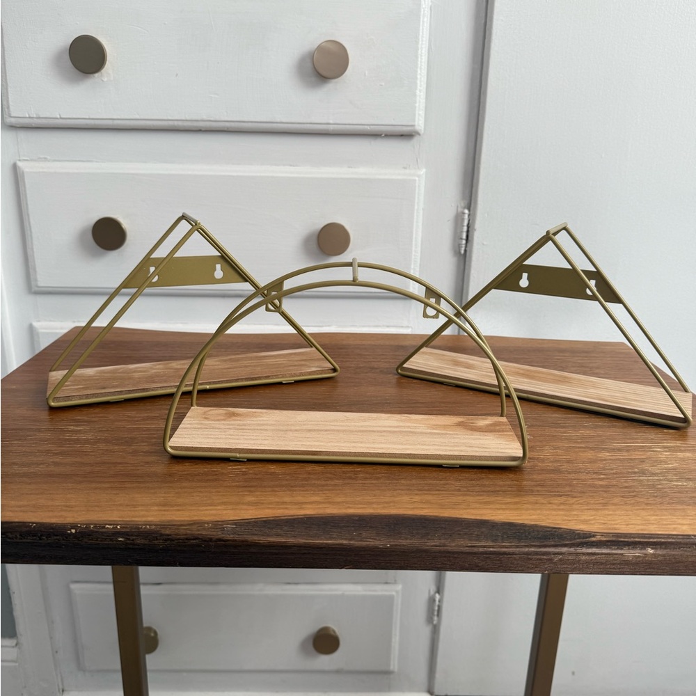 3 small wall shelves with gold toned metal and natural wood
